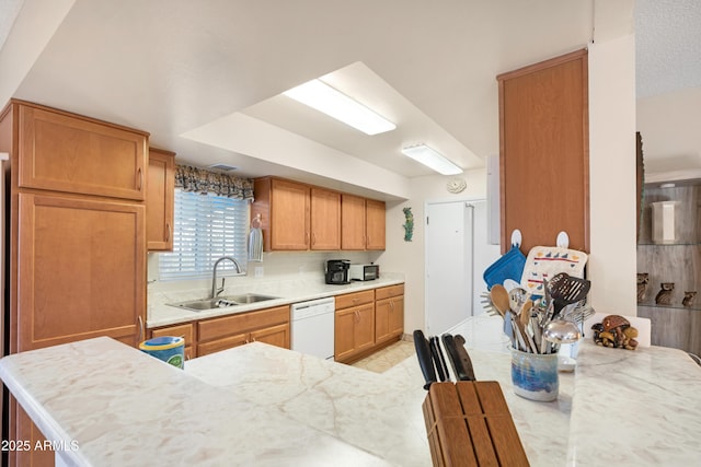 kitchen with white dishwasher and sink