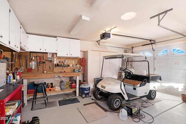 garage featuring a workshop area and a garage door opener