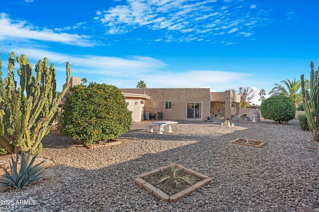 back of house with a patio area