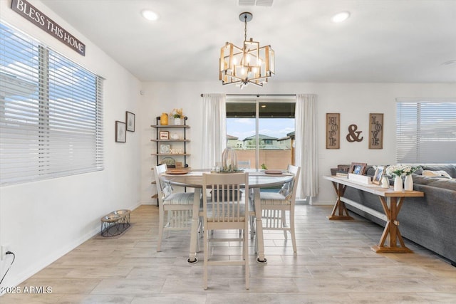 dining area featuring recessed lighting, baseboards, a chandelier, and wood tiled floor