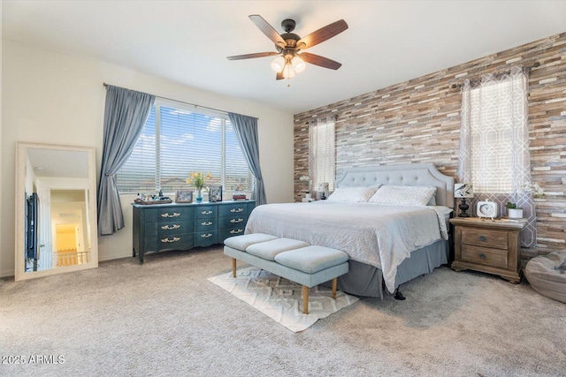 bedroom featuring light carpet and ceiling fan