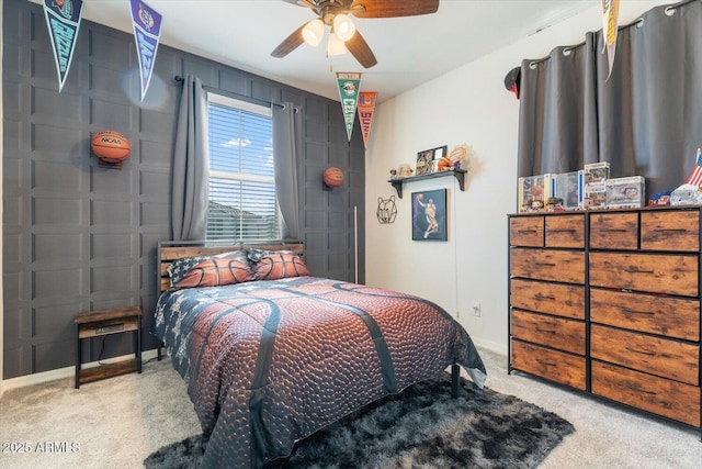 carpeted bedroom featuring ceiling fan and baseboards