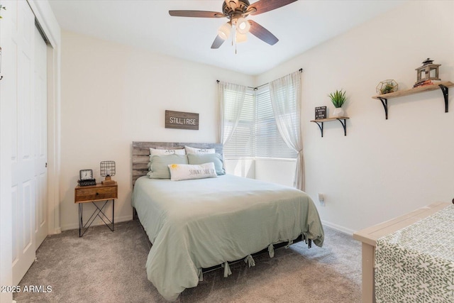 bedroom featuring a closet, ceiling fan, baseboards, and carpet floors