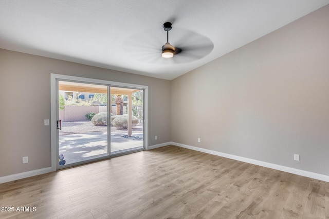 unfurnished room featuring light wood-style floors, baseboards, and a ceiling fan