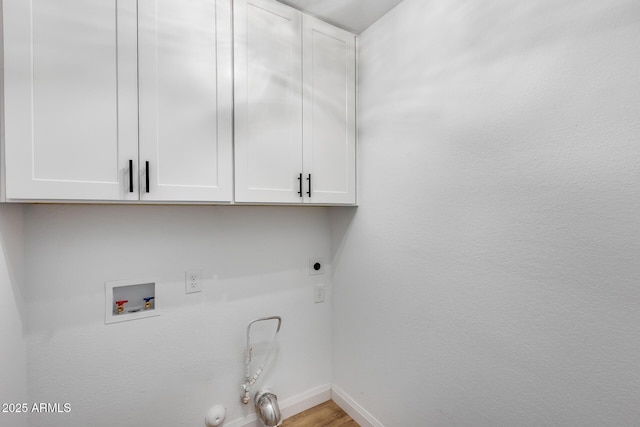 washroom featuring washer hookup, cabinet space, gas dryer hookup, electric dryer hookup, and baseboards