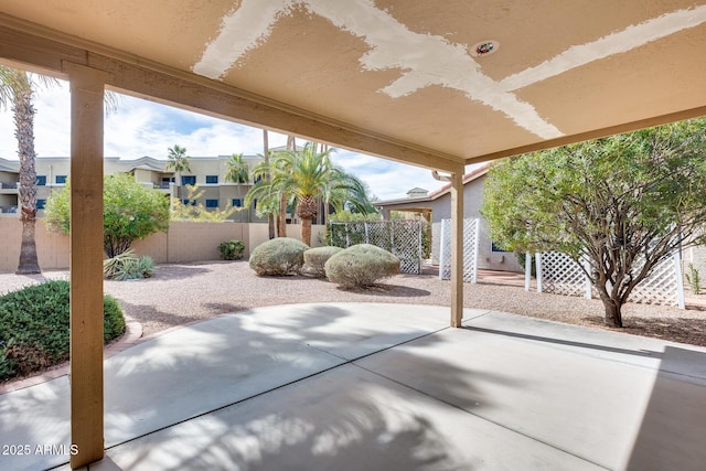 view of patio featuring fence