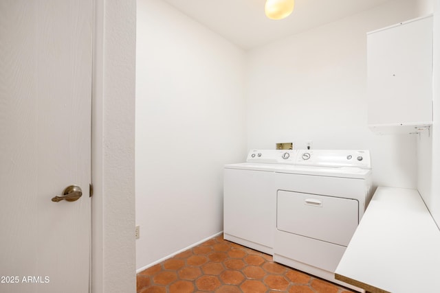 laundry room with laundry area, baseboards, washer hookup, and tile patterned floors