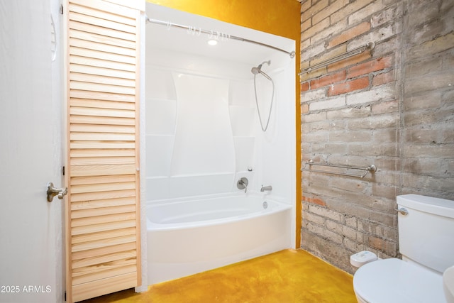 full bath with brick wall, a closet, bathtub / shower combination, and toilet