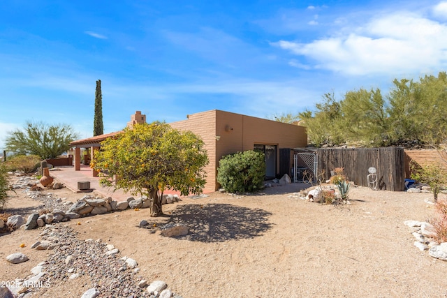 exterior space with fence and a patio