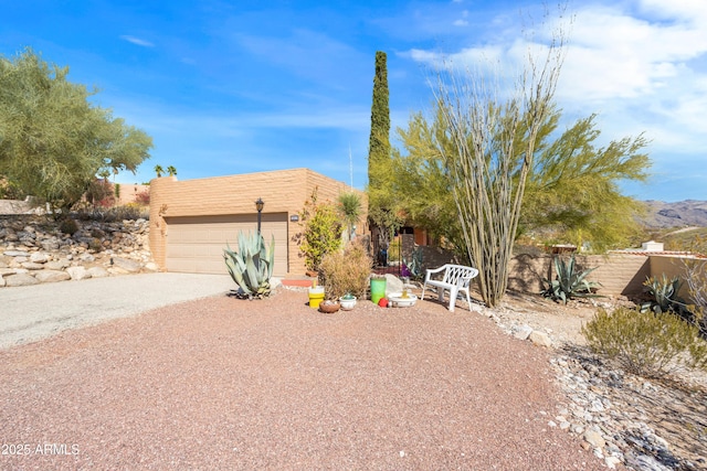 southwest-style home featuring a garage