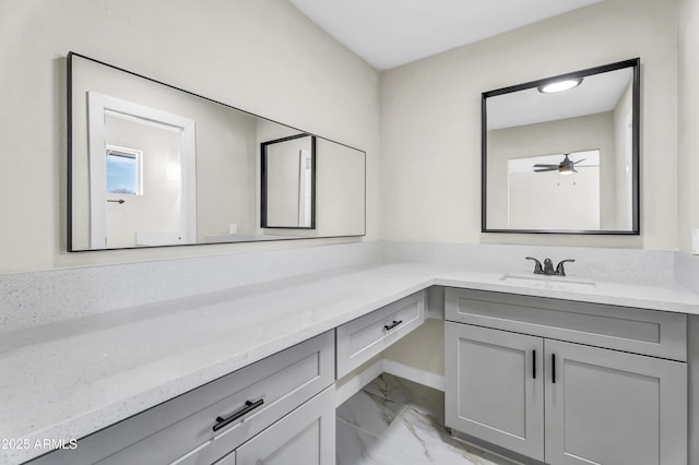 bathroom with ceiling fan, marble finish floor, and vanity