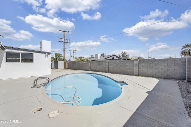 view of pool featuring a patio area, a fenced backyard, and a fenced in pool