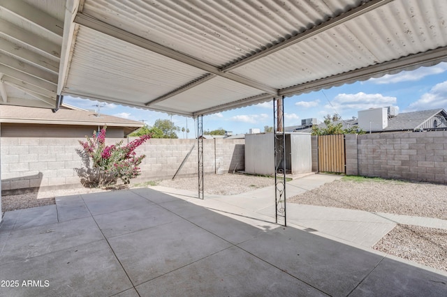view of patio / terrace featuring fence private yard and a gate