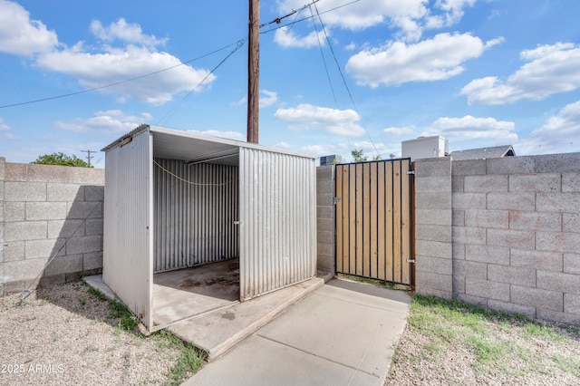 view of gate featuring fence