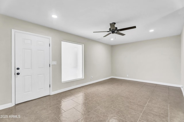 empty room featuring light tile patterned floors, baseboards, a ceiling fan, and recessed lighting