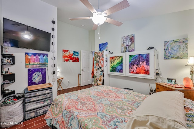 bedroom with ceiling fan and wood finished floors