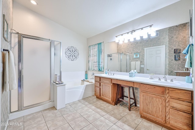 full bathroom featuring vaulted ceiling, tile patterned flooring, a sink, and a shower stall