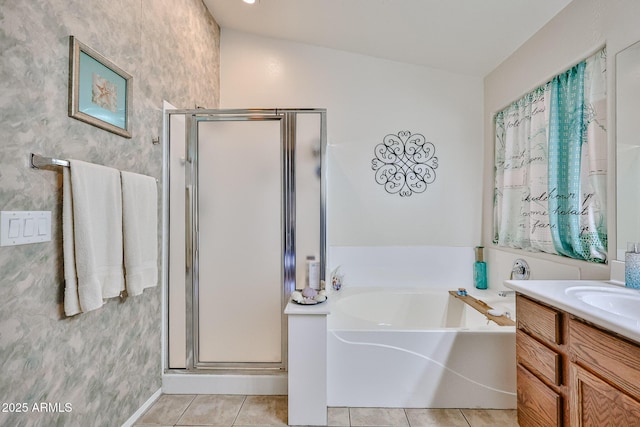 bathroom with vanity, tile patterned flooring, a bath, and a shower stall