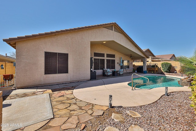 view of swimming pool with a patio area, a fenced backyard, a ceiling fan, and a fenced in pool