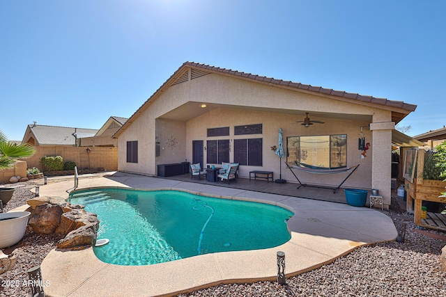 view of swimming pool with a patio area, a fenced backyard, a ceiling fan, and a fenced in pool