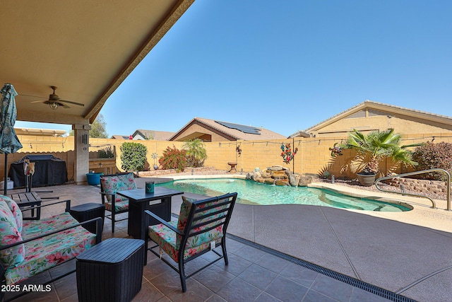 view of patio with ceiling fan, a fenced backyard, and a fenced in pool