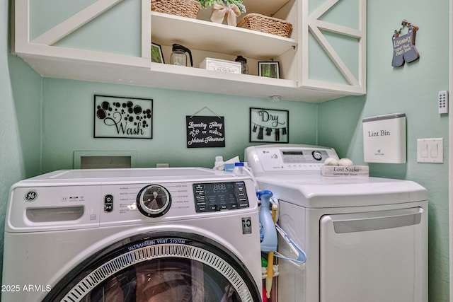 washroom featuring laundry area and independent washer and dryer