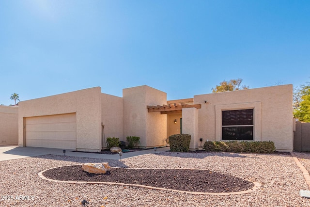 southwest-style home with a garage