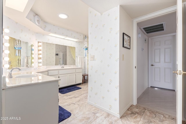 bathroom with vanity and an enclosed shower