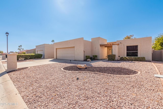 pueblo-style house with a garage