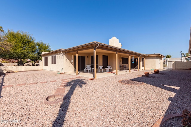 rear view of property featuring a patio area