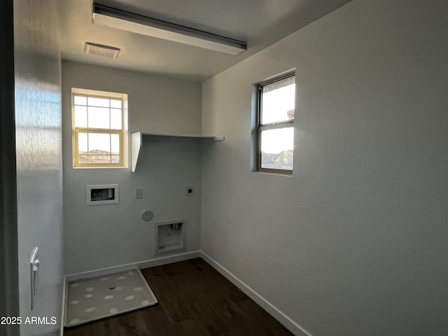 clothes washing area featuring hookup for a washing machine, a wealth of natural light, visible vents, electric dryer hookup, and laundry area