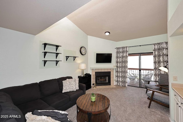 205 N 74th St Unit 248, Mesa, AZ 85207 - living room with carpet flooring, vaulted ceiling, a tiled fireplace, and a textured ceiling