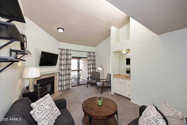 205 N 74th St Unit 248, Mesa, AZ 85207 - carpeted living room with a tile fireplace, high vaulted ceiling, and a textured ceiling