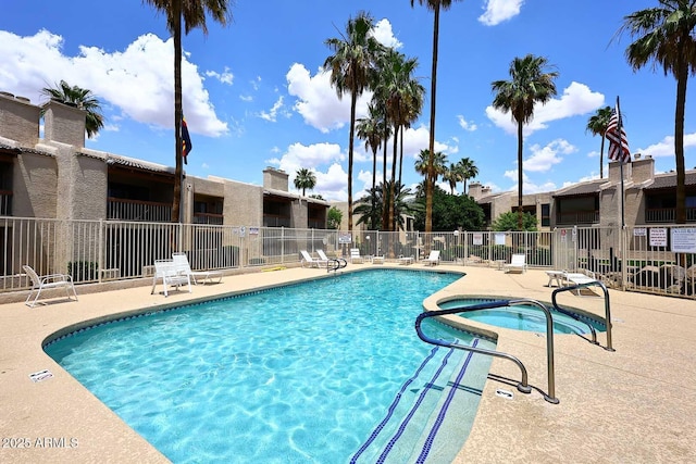 205 N 74th St Unit 248, Mesa, AZ 85207 - community pool featuring a patio area, a community hot tub, and a residential view