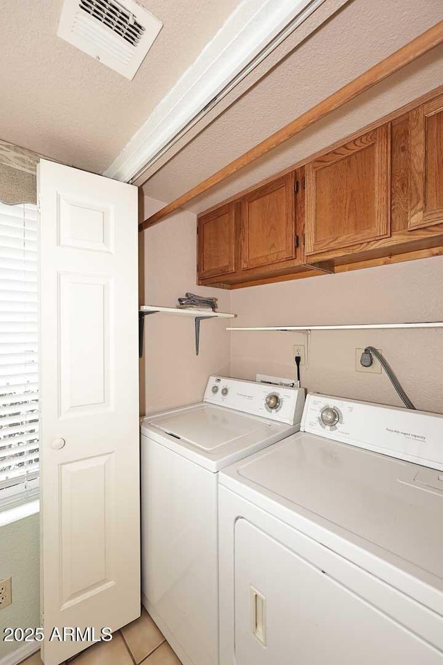 205 N 74th St Unit 248, Mesa, AZ 85207 - laundry area featuring cabinet space, independent washer and dryer, and light tile patterned flooring