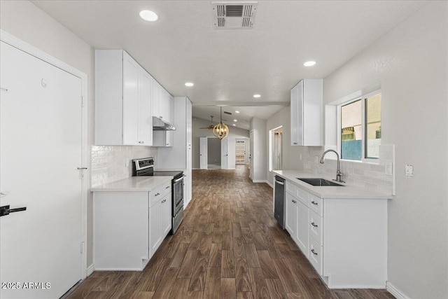 1736 E Bluefield Ave, Phoenix, AZ 85022 - kitchen featuring appliances with stainless steel finishes, under cabinet range hood, dark wood-style floors, backsplash, and recessed lighting