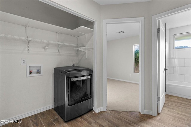 1736 E Bluefield Ave, Phoenix, AZ 85022 - washroom featuring washer / clothes dryer and wood finished floors