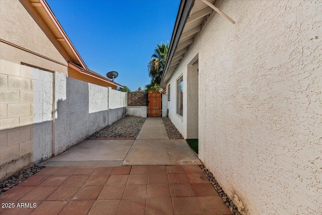 1736 E Bluefield Ave, Phoenix, AZ 85022 - view of home's exterior featuring stucco siding, a gate, and a patio
