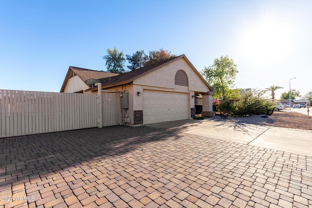 view of side of home with a garage