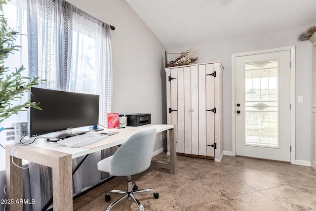 home office featuring vaulted ceiling