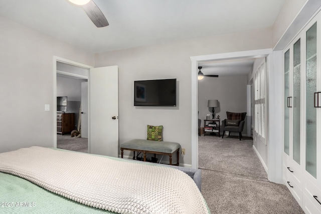 bedroom featuring ceiling fan and light carpet