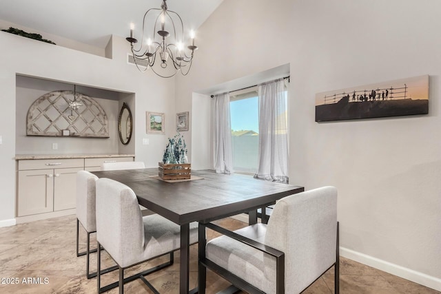 dining room with lofted ceiling and a notable chandelier