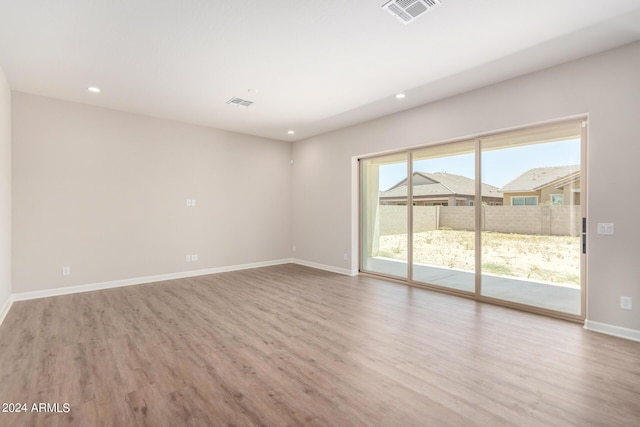 empty room featuring light hardwood / wood-style floors