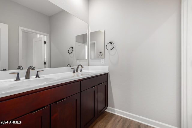 bathroom with vanity and hardwood / wood-style flooring