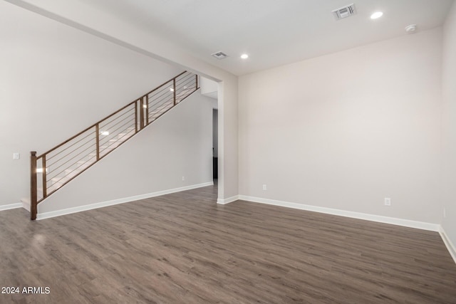 unfurnished living room featuring dark hardwood / wood-style floors