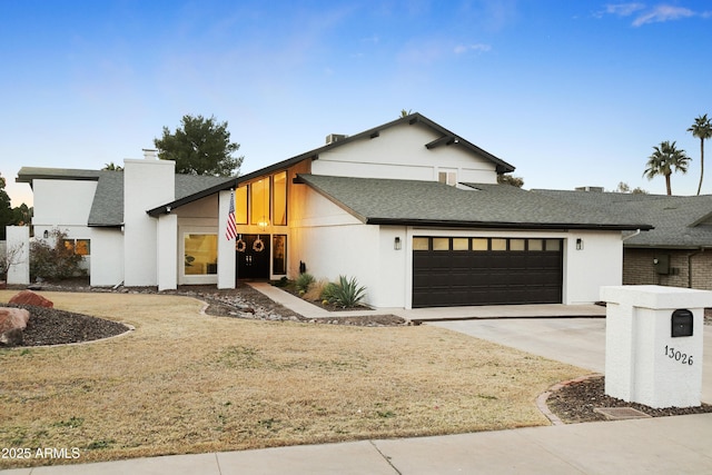 view of front of home with a garage