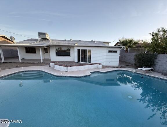 view of pool with a patio area, fence, and a fenced in pool