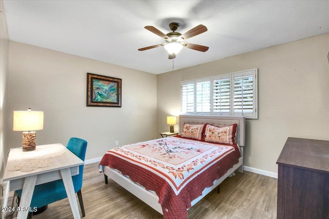 bedroom featuring ceiling fan and hardwood / wood-style floors