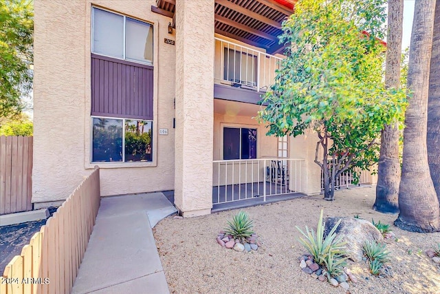 entrance to property featuring a balcony