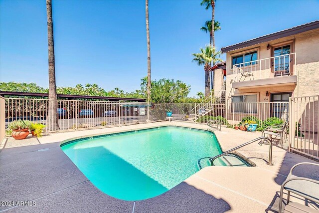 view of pool featuring a patio area